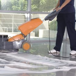 Cleaning the floor with machine